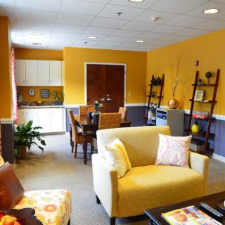 A cozy and brightly colored living room with modern furniture and decor.
