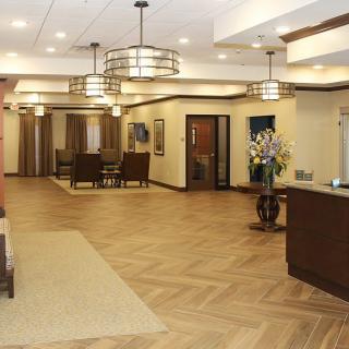A modern lobby with stylish lighting and a welcoming reception desk.