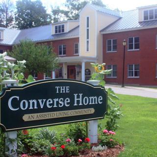 The Converse Home with its welcoming sign and well-maintained garden.