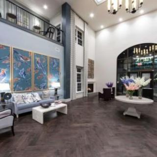 A modern lobby with stylish furniture, artwork, and elegant lighting.