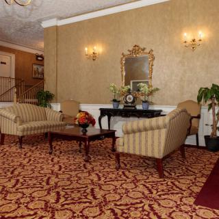 A hotel lobby with elegant seating and decorative elements.