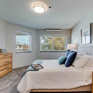 A modern and comfortable bedroom with natural lighting.