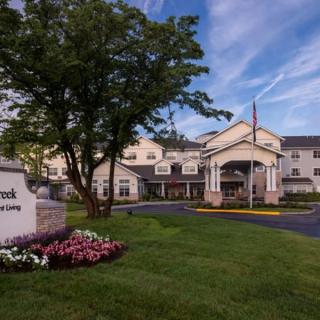 A hotel exterior with manicured landscaping and a welcoming entrance.