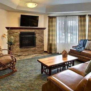 Cozy living room with a fireplace and comfortable seating.