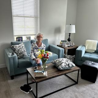 A cozy living room setting with comfortable seating and decorative elements.