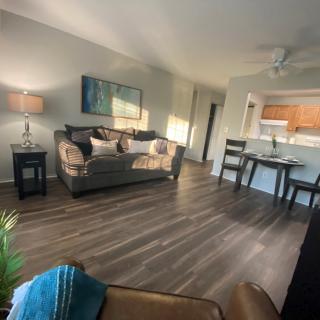 Cozy living room with a comfortable sofa and dining area.