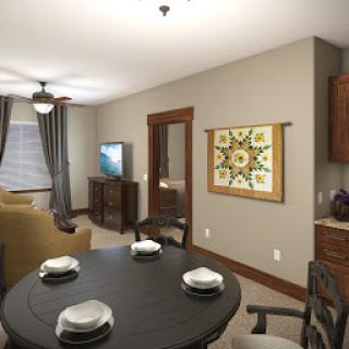 A cozy interior featuring a dining area and living space, complete with tasteful decor.