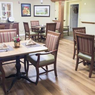 A cozy dining area with neatly arranged tables and chairs.