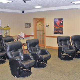 A cozy waiting area featuring multiple massage chairs for relaxation.