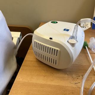 A nebulizer device used for administering medication in the form of a mist to treat respiratory conditions.