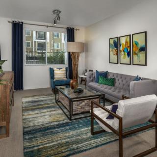 A modern living room with contemporary furniture and vibrant artwork.