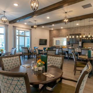 A modern dining area with elegant decor and comfortable seating.