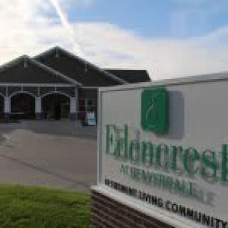 Entrance to a senior living community with visible signage.