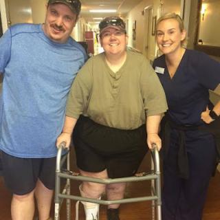 A moment of triumph: celebrating progress in rehabilitation with supportive friends.