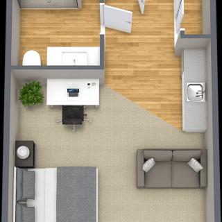 A compact apartment floor plan featuring a bedroom, kitchen, and living area with minimalist design.