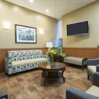 A cozy and modern waiting area featuring comfortable seating and tasteful decor.