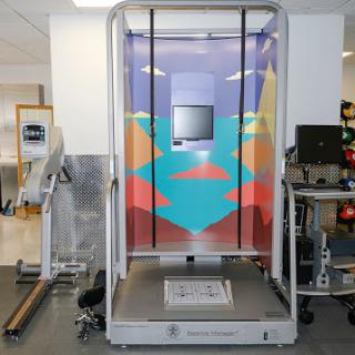 A high-tech body analysis machine in a modern gym setting.