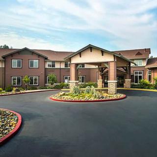 A well-maintained residential building with a landscaped entrance.