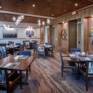 A cozy restaurant dining area with neatly arranged tables and stylish decor.