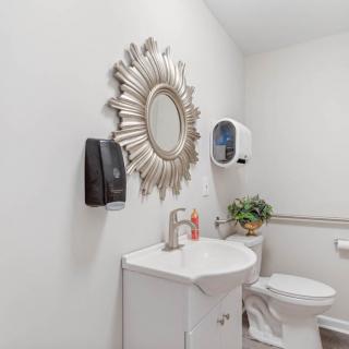 A clean and modern bathroom with decorative elements.