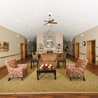 A cozy living room with comfortable seating and elegant decor.