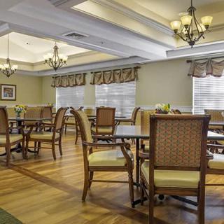 An elegant dining room with classic decor and ample seating.