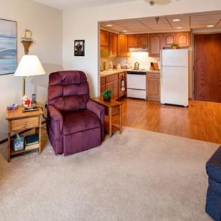 Cozy living room with an open view into the kitchen area.