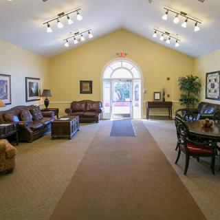 A well-lit lobby with comfortable seating and elegant decor.