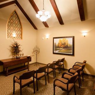 A cozy room with arranged seating and warm lighting.