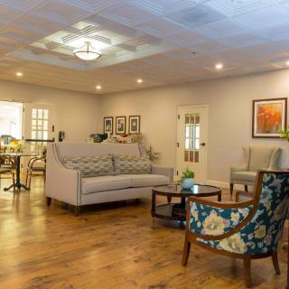 A cozy living room with stylish furniture and warm lighting.