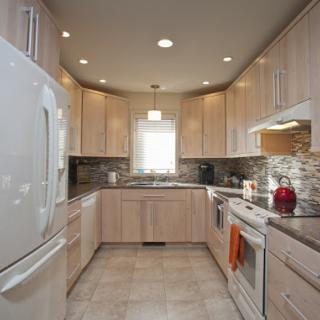 A modern kitchen featuring sleek cabinetry and contemporary appliances.