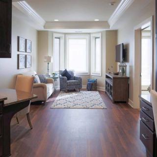 A cozy living room with comfortable seating, natural light, and elegant decor.