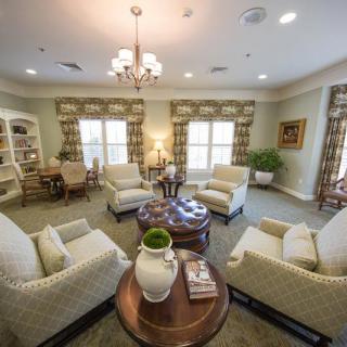 A cozy living room with comfortable seating and traditional decor.
