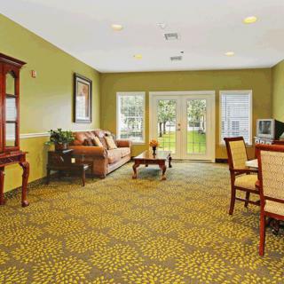 Spacious living area with comfortable seating and elegant decor.