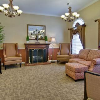 A traditional living room with elegant furniture and a warm ambiance.