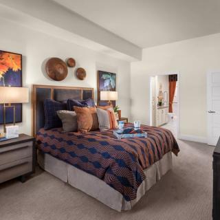 A cozy and modern bedroom with stylish decor and comfortable furnishings.