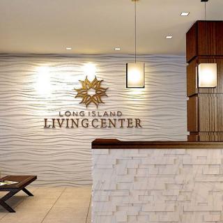 A modern reception area at the Long Island Living Center, featuring elegant lighting and wood accents.