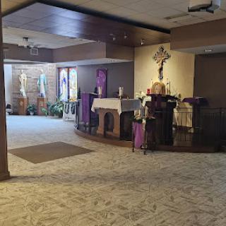 A serene view of the church interior featuring the altar, designed for worship and reflection.