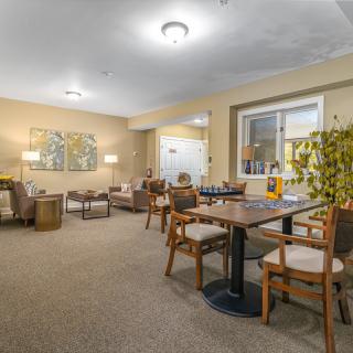 A cozy living room with comfortable seating and warm lighting.
