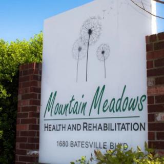 Sign for Mountain Meadows Health and Rehabilitation facility.