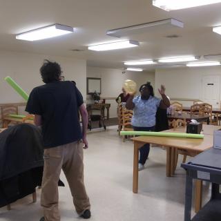 People engaging in activity inside an office space.