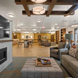 A modern, cozy lounge area with comfortable seating and stylish lighting.