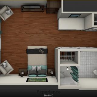 An overhead view of a compact apartment floor plan featuring a bedroom, living area, and bathroom.