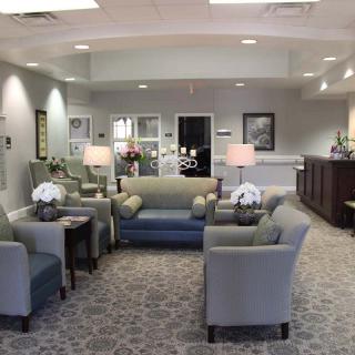 A modern waiting room with comfortable seating and elegant decor.