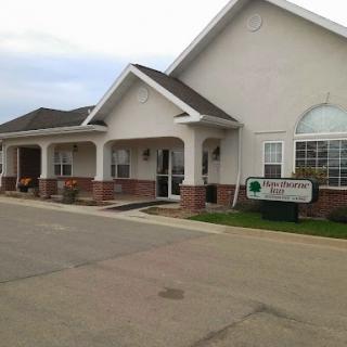A view of a welcoming residential building with a clear entrance and lawn.