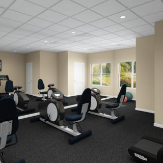 A modern fitness center with stationary bikes and exercise equipment.