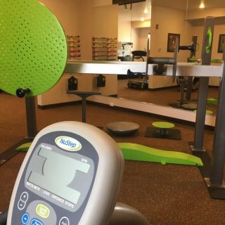 A view of a gym featuring various fitness equipment and exercise machines.