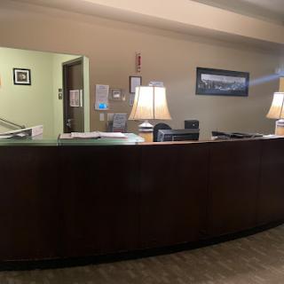 A view of a modern reception desk in an office setting.