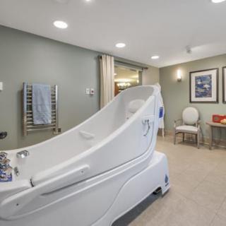 A modern bathroom featuring an accessible bathtub designed for ease of use.