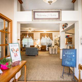 A warm and welcoming lobby area with comfortable seating and decorative elements.
